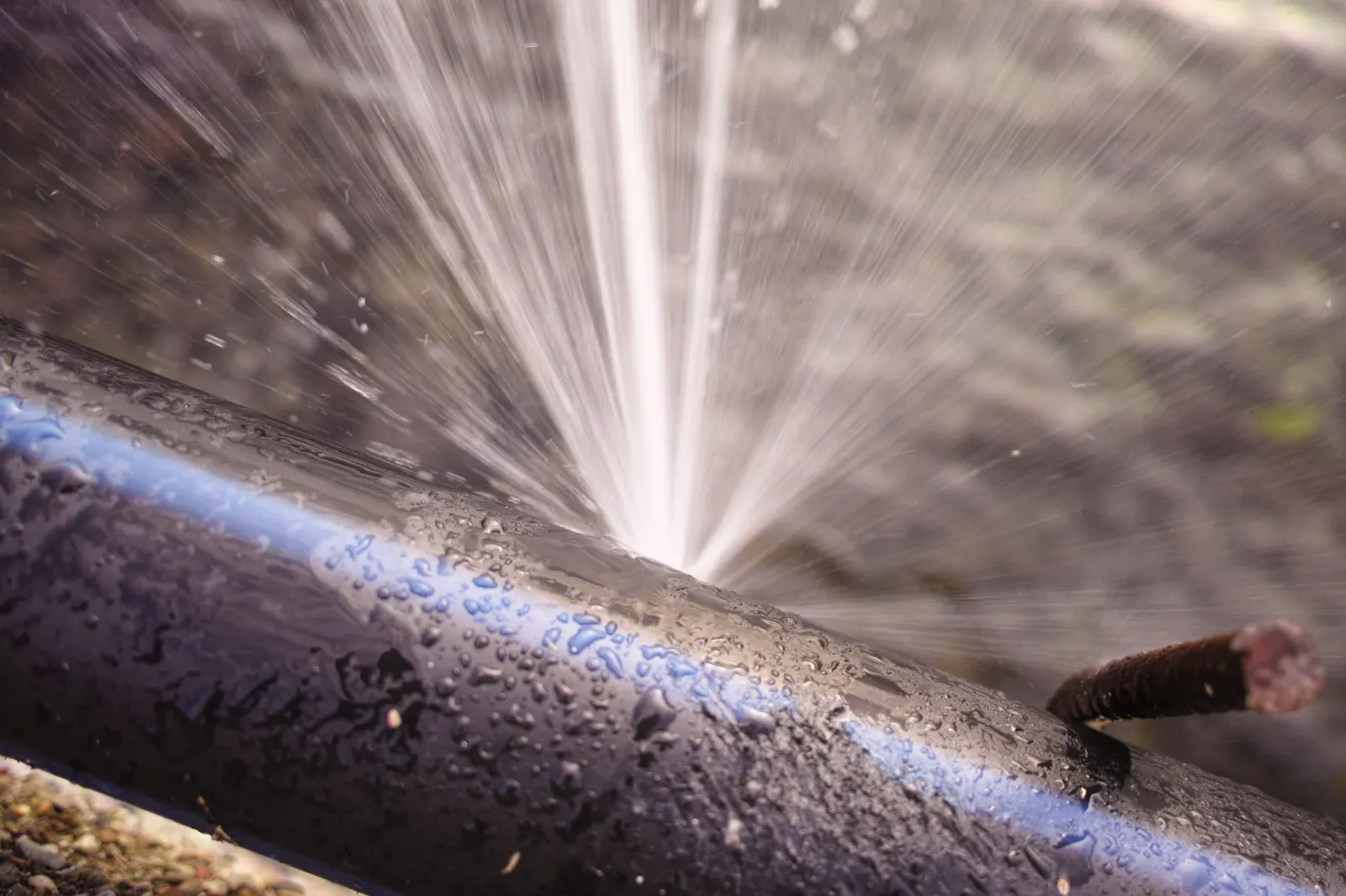 Burst water pipe exposed for repair