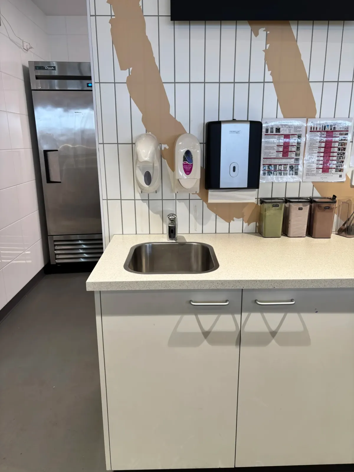 Sensor tap on a basin in a commercial amenities area