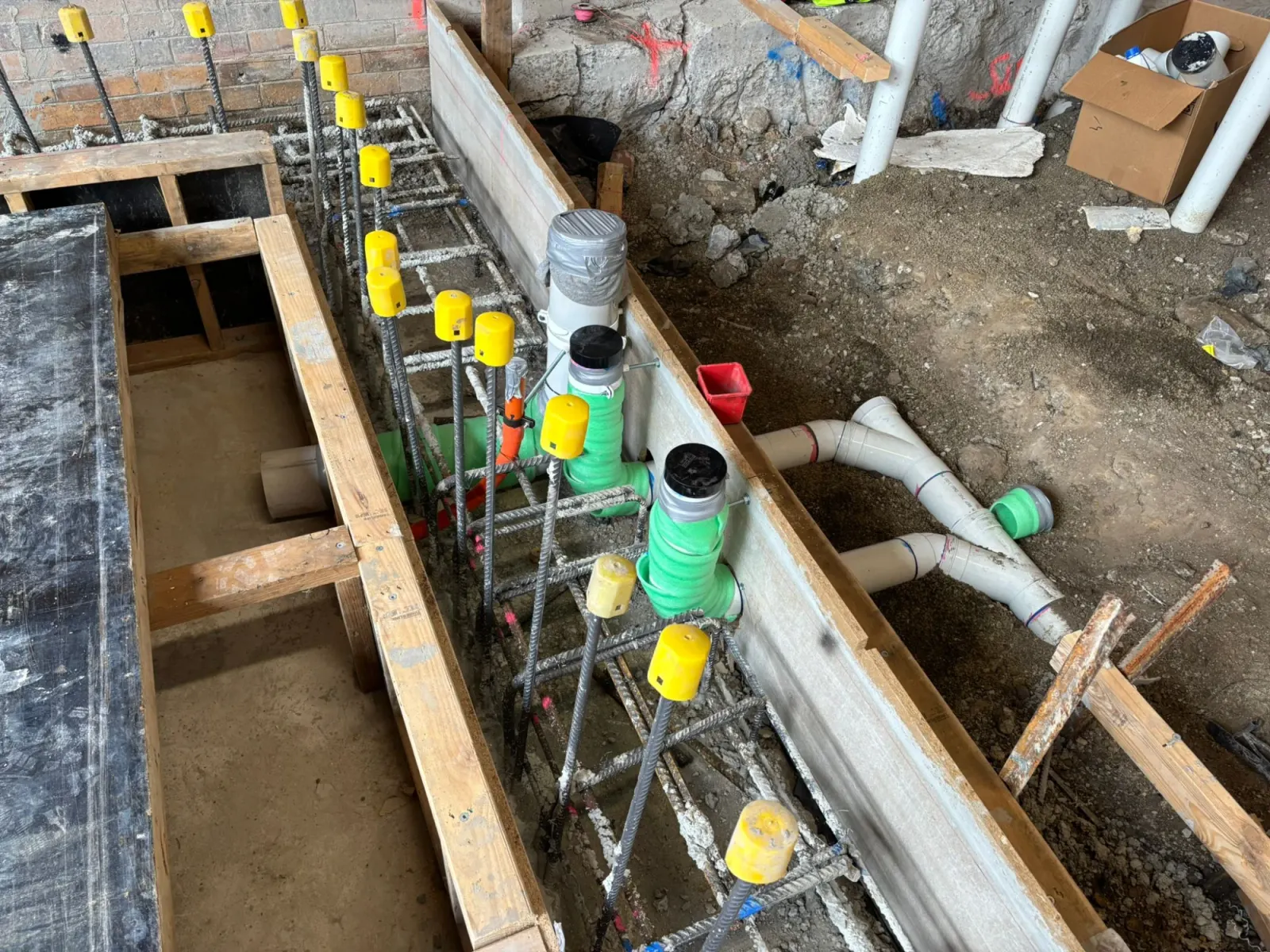 Sewer lift shaft with pump well pipework installed below floor level